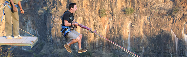 Young man bungee-jumps