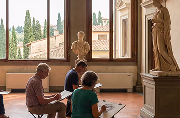 Artists sketching in a museum