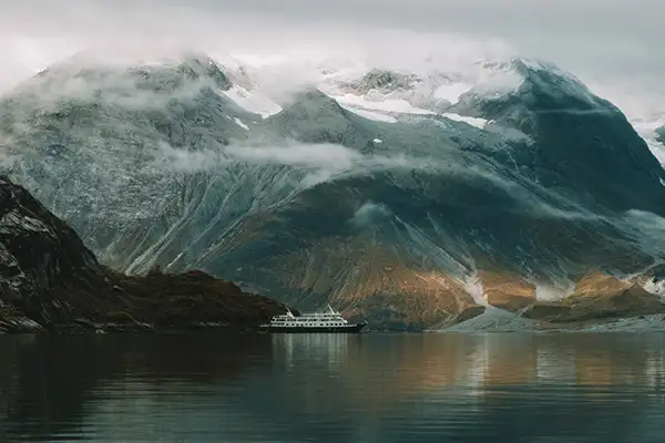 A small expedition ship sails the Northwest Passage, Alaska (c)Uncruise