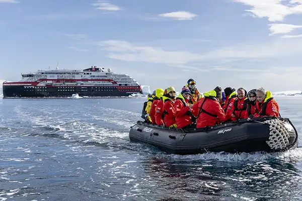 A zodiac departs a ship in Fournier Bay, Antarctica (c)Hurtigruten