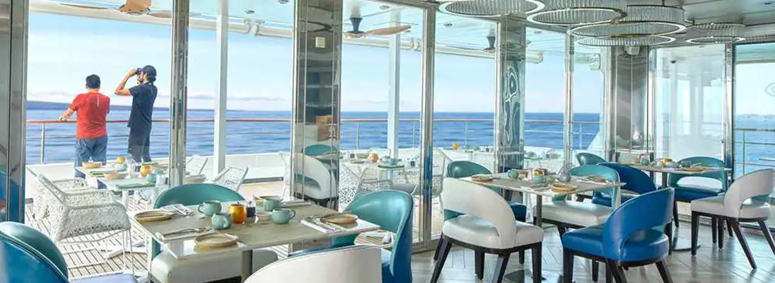 Windowed dining room of the National Geographic Islander II by Lindblad Expeditions