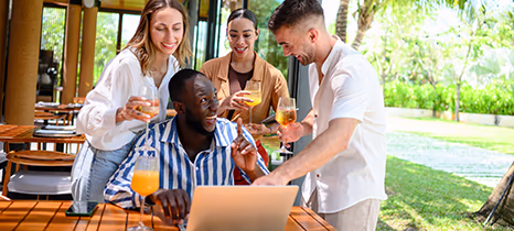 Group of employees celebrating on the beach