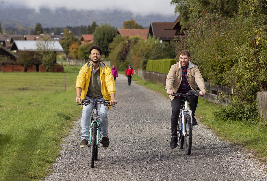Two boyfriends cycling through the countryside