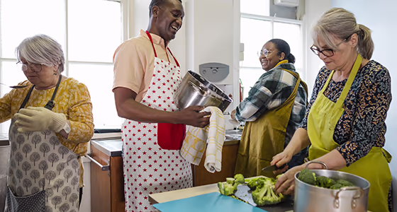 A group volunteers in the shelter kitchen