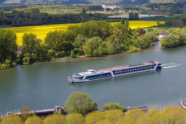 An AmaWaterways river ship glides along a river