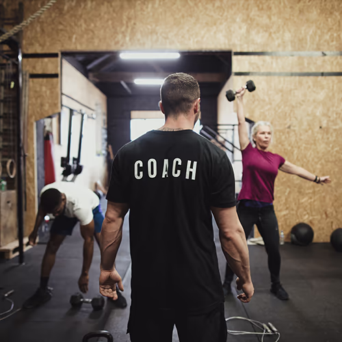 Personal training coach with clients