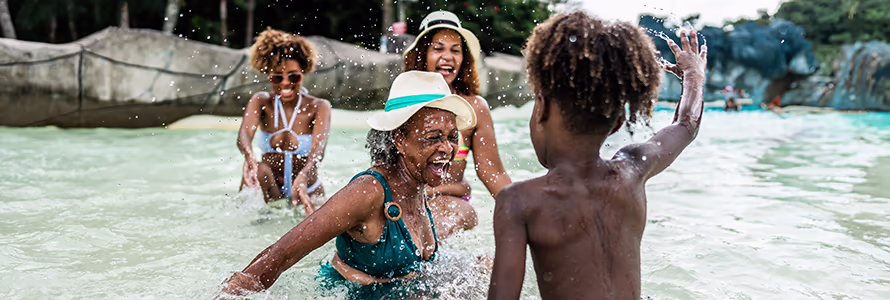 Grandkids and Grandma playing in a pool