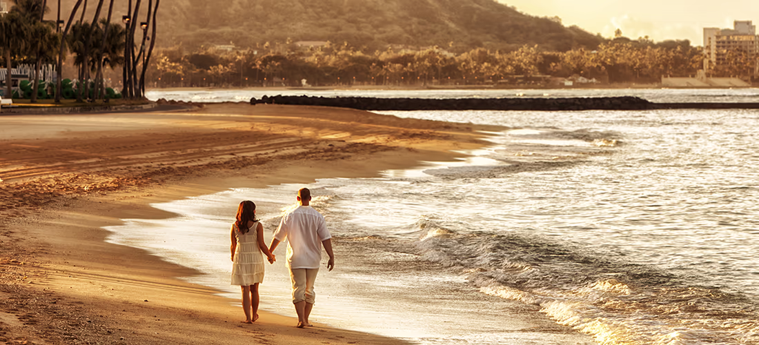 Couple Walking Along Hawaii Beach